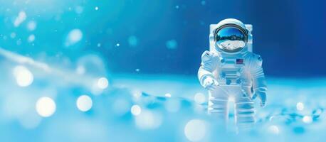 A close-up photo of a plastic toy astronaut figure on a blue background with copy space. is