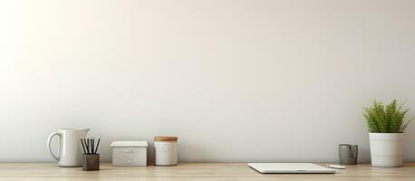 A white desk table with available space, containing supplies and a coffee mug. The workspace photo