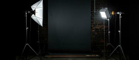 A professional photography studio flash on a lighting stand is seen on a black background with photo