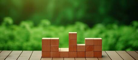 How To Renew Your Life Symbol With Brick Blocks. Wooden Table with Green Background. Copy Space. photo