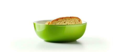 A green bowl with toast placed inside, with empty space on the right side. It is isolated on photo