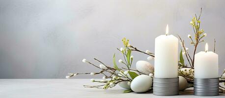 Easter Candle Eggs, Easter Bunny, and Willow Branches on a white textured background. represents photo