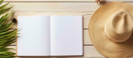 A blank writing book with summer beach accessories in the background, offering plenty of space photo