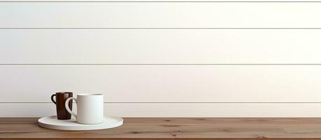 A white desk table with available space, containing supplies and a coffee mug. The workspace photo