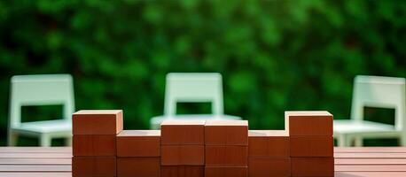 How To Renew Your Life Symbol With Brick Blocks. Wooden Table with Green Background. Copy Space. photo