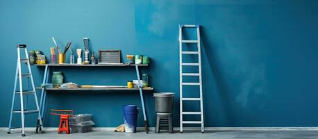 A table near a blue wall holds a metallic folding ladder and painting tools. space available photo