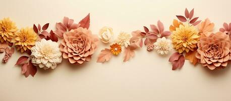 Autumn Floral Composition with a border created using fresh flowers on a pastel beige background. photo