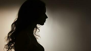Shadow of a woman on a smooth surface from the side photo
