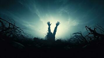 Zombie hand emerging from grave photo