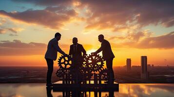 Businessmen join gears in a sunset themed puzzle symbolizing partnership cooperation teamwork and creativity photo