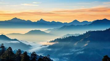 Silhouettes of Himalayas visible through colorful fog on Khalia top trek trail in Uttarakhand India photo