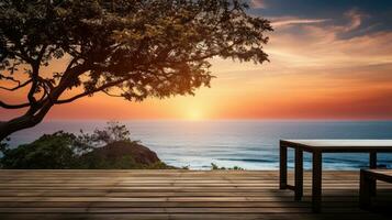 Wooden table on the beach with sea view during sunset or sunrise silhouette of tropical tree on terrace idyllic seashore photo