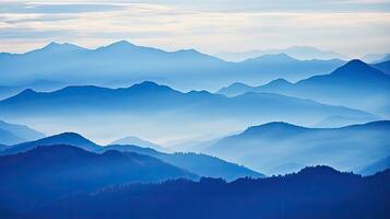 Bluish Swiss Alps Mount Niesen silhouettes during an autumn evening photo