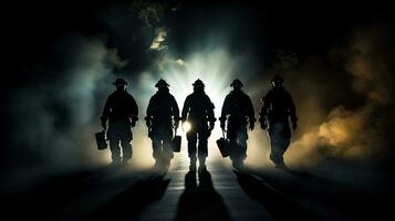 Firefighters with flashlights on their chests walking away from smoke photo