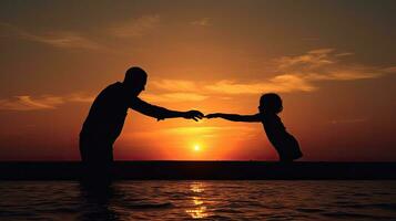 Child and adult hands touch fingers by the sea at sunset photo