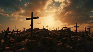 Crosses on hill at sunset symbolizing Jesus crucifixion photo
