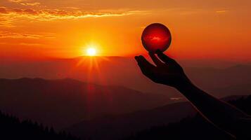 Attempting to grasp the sunset in the Beskydy Mountains Czech Republic Holding the fiery sun photo