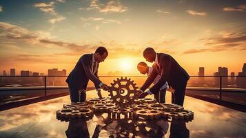 Businessmen join gears in a sunset themed puzzle symbolizing partnership cooperation teamwork and creativity photo