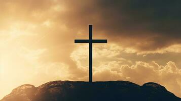 Silhouette of cross on hill against sky Christianity emblem photo