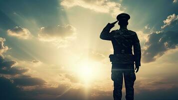 Soldier silhouette saluting at sunrise symbolism defense national loyalty respect photo