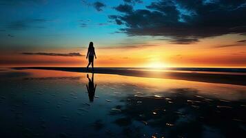 Reflective image of girl walking by the shore photo