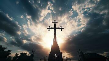 Silhouette of cross and belfry against cloudy sky at Catholic church in Shrine of our Lady Trsat photo