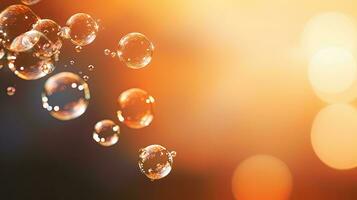 Clear carbonated drink bubbles float above a hazy backdrop photo