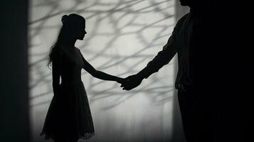 Silhouetted couple s hands monochrome with vignette photo