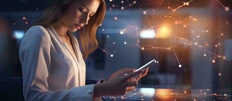 Businesswoman using smartphone browsing the internet on screen at modern office representing data or social networks concept photo