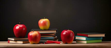 Back to school supplies with apple and empty blackboard photo