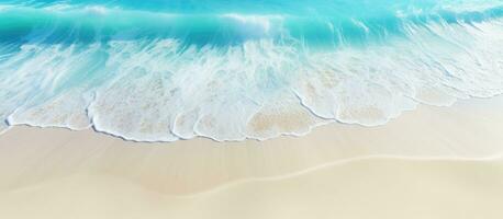 Aerial view of a beach with clear blue water and sunlight representing summer vacation and natural beauty photo