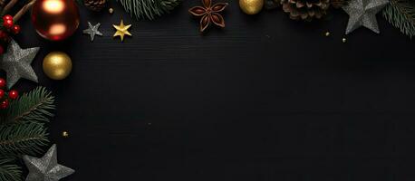 Top down black background with Christmas decorations for flat lay with room for text photo