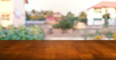 Empty wooden table in front of abstract blurred background of coffee shop . can be used for display or montage your products.Mock up for display photo