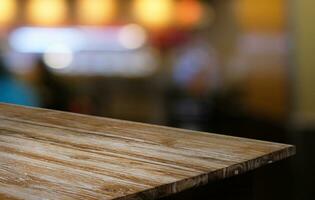 Empty wooden table in front of abstract blurred background of coffee shop . can be used for display or montage your products.Mock up for display of product photo