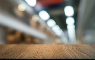 Empty wooden table in front of abstract blurred background of coffee shop . can be used for display or montage your products.Mock up for display of product photo