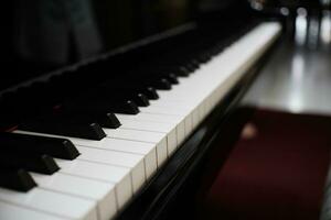 Piano keyboard background with selective focus. photo