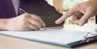Man Completing Application Form during job interview. human resources concept. photo