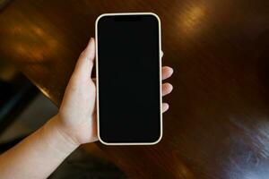 Close up of women's hands holding cell telephone blank copy space screen. smart phone with technology concept photo