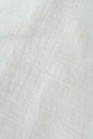 Fabric backdrop White linen canvas crumpled natural cotton fabric Natural linen top view  background  Organic Eco textiles White Fabric texture photo
