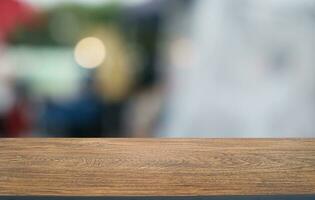 Wood Table Top in Blur Background room interior with empty copy space. photo