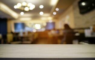 Wood Table Top in Blur Background room interior with empty copy space. photo