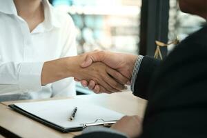 Lawyer handshake with client. Business partnership meeting successful concept. photo