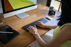 Graphic designer working on digital tablet and computer. Designer Asian Woman artist drawing on graphic tablet  Artist Creative Designer sketch graphic drawing creative photo