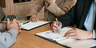 Examiner reading a resume during job interview at office Business and human resources concept photo