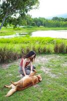 woman playing with her dogs at park Lifestyle and friendship photo