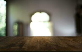 Wood Table Top in Blur Background room interior with empty copy space. photo