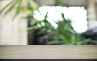 Wood Table Top in Blur Background room interior with empty copy space. photo