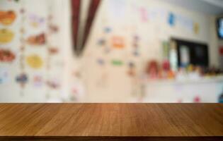 Empty dark wooden table in front of abstract blurred bokeh background of restaurant . can be used for display or montage your products.Mock up for space. photo