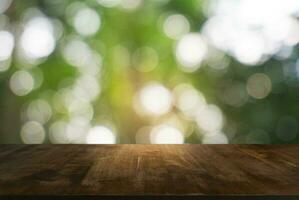 Empty dark wooden table in front of abstract blurred bokeh background of restaurant . can be used for display or montage your products.Mock up for space photo