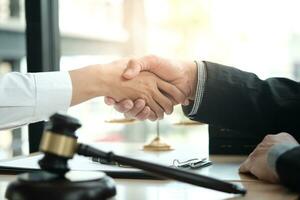 Lawyer handshake with client. Business partnership meeting successful concept. photo